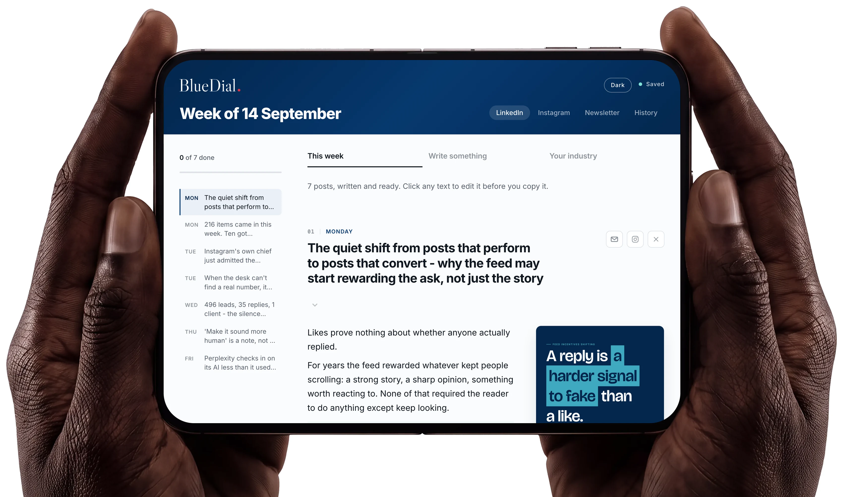 A phone held in two hands showing the BlueDial desk: the week of 14 September, seven posts written and ready, with the first one open